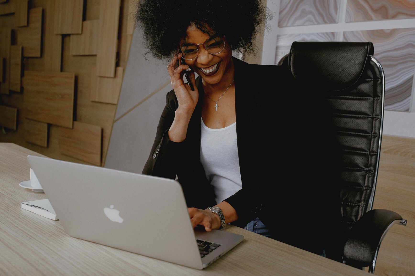 Woman In Black Blazer Sitting On Black Office Chair